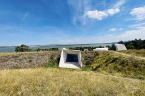 a house on top of a grassy hill at Chaloupka Pálava in Pavlov +15 photos