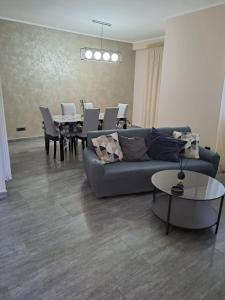 a living room with a couch and a table at Le due Rive in Tufo