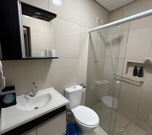 a bathroom with a toilet and a sink and a shower at Lady Estúdio - Hotel + café em Extrema MG in Extrema +38 photos