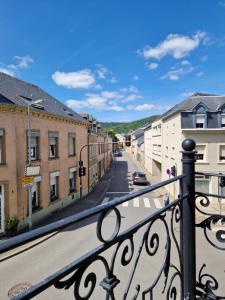 a view of a city street from a balcony at Echternach Center Charming Apartment in Echternach