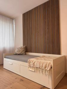 a bedroom with a bed with a large window at Adriany apartmán in Bayerisch Eisenstein