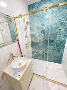 a bathroom with a shower and a sink at Mar y Sol in Batumi +10 photos
