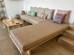 a large couch sitting in a living room at Nefeles View in rkadiko Chorio
