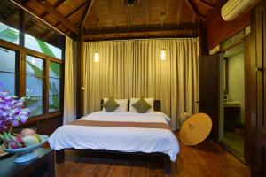 Ein Bett oder Betten in einem Zimmer der Unterkunft The Quarter Pai