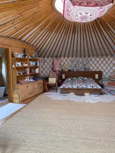 a bedroom with a bed in a yurt at Káli Jurta in Tapolca +18 photos