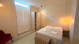 a small bedroom with a bed and a window at B&B Casa di Leo in Brindisi