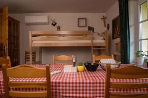 a table with a red and white checkered table cloth at Naturidyll Lavantall in Lading