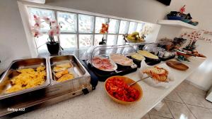 a kitchen counter with many dishes of food on it at Olimpo degli Dei in Agerola