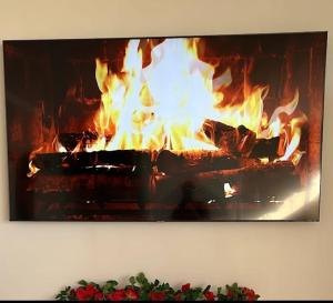 a fire in a fireplace with flames in it at Luxus Spa Wellness Apartment in Heiligenhaus