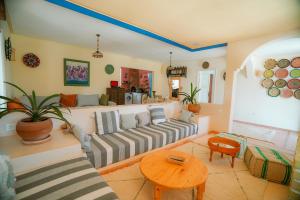 a living room with a couch and a table at Villa Aloe Vera Privée in Essaouira