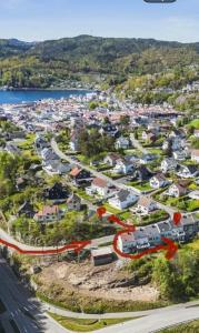 an aerial view of a suburb with houses at Koselig leilighet in Flekkefjord