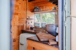 a kitchen with a sink and a bowl on a counter at Olívia, Caravana Vintage, Castelo de Vide in Castelo de Vide +9 photos