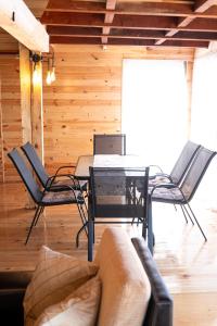 a living room with a table and chairs at Kućica Pirata in Ulcinj