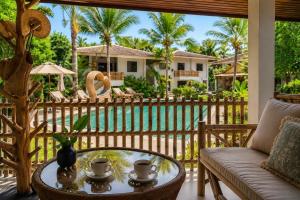 a living room with a couch and a table at Tulum Villa Resort Koh Samui in Bophut