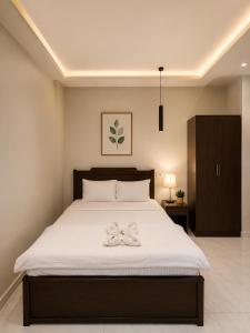 a bedroom with a bed with a bow on it at Sun Hotel in Cairo