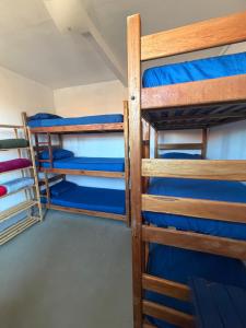 a group of bunk beds in a dorm room at Casa Iter Hostel & Base Trail in Lençóis
