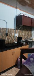 a kitchen with a sink and a counter top at Casa Amarilla in San Blas