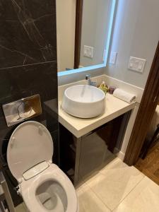 a bathroom with a white toilet and a sink at Modern House in Toronto in Toronto +35 photos