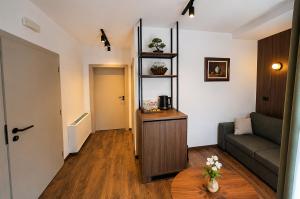 a living room with a couch and a table at NOCE Luxury Apartments in Ohrid