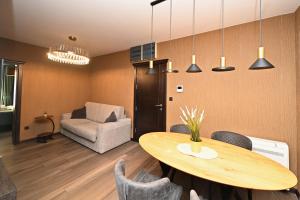 a living room with a table and a chair at Casa Nuova in Kotor