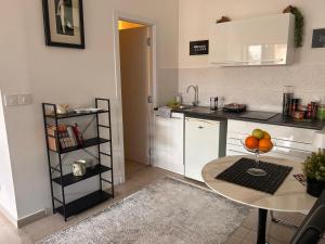 a kitchen with a table and a counter top at Apartman 4N with free parking in Belgrade