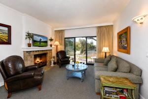 a living room with a couch and a fireplace at Spacious 2BR condo with pool, fireplace,at Silverado Country Club in Napa