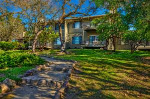 a house with a stone path in front of a yard at Spacious 2BR condo with pool, fireplace,at Silverado Country Club in Napa