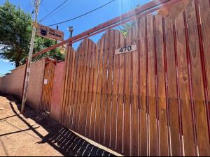 a wooden fence with a speed limit sign on it at Hotel Turi Atacama in San Pedro de Atacama