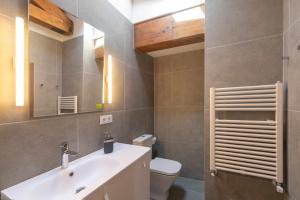 a bathroom with a sink and a toilet at Casa Llanes con Jardín, Vistas y Barbacoa – Maruja in La Pereda de Llanes +47 photos