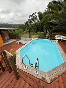 a large swimming pool on a wooden deck at Sweet Mangot in Gros-Morne