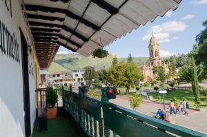 a balcony of a building with a view of a church at Chalet de carmelita in Nobsa