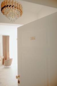 a chandelier hanging over a door in a room at Kiranovi Premium Stay in Bitola +10 photos
