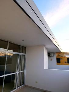 a room with a window and a white wall at Complejo Carrodilla4 in Ciudad Lujan de Cuyo