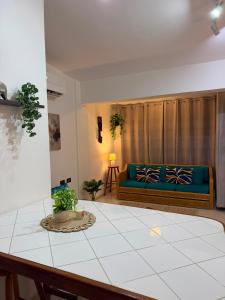 a living room with a couch and a table at Isla de margarita in Pampatar +33 photos