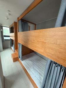 an overhead view of a bunk bed in a room at Hostel K wave Only Female Hongdae in Seoul