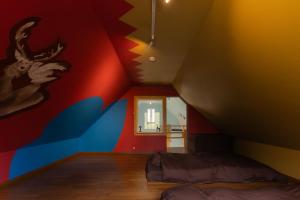 a bedroom with a mural of a moose on the wall at Kussharoko Artemina Deer in Teshikaga