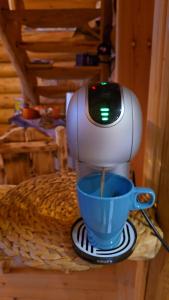 a mixer sitting on a table with a blue bowl at Brvnara Floridita u prirodi - blizu Manastira Tavna in Ugljevik +11 photos