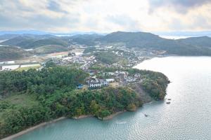 an island in the middle of a body of water at Taean Napoli Pension in Seosan
