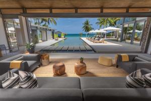 a large living room with a view of the ocean at Villa Amarelo in Ban Han Pa To +45 photos