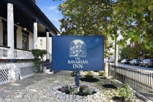 a sign for the bavarian inn in front of a house at The Bavarian Inn 6 Chic 1 BDR in Covington