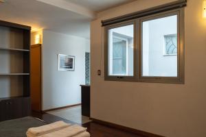 a room with a large window in a room at Zoom Apartments Hotel in Córdoba +41 photos