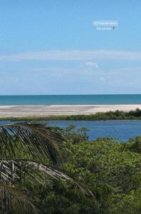 a view of a beach with the ocean in the background at Kayma Beach in Guriú