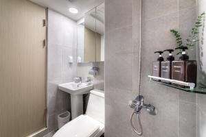 a bathroom with a toilet and a sink at Bliss Hotel Myeongdong in Seoul +41 photos
