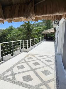 a balcony of a house with a tile floor at Villa Linda in Acapulco
