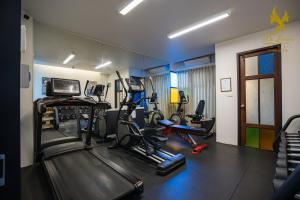 a gym with several tread machines in a room at De Lanna Hotel in Chiang Mai