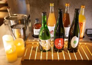 a group of wine bottles sitting on a cutting board at Super Hotel Premier Ginza in Tokyo