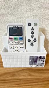an electronic calculator sitting on top of a plastic container at Ueno Sakura Inn 上野公园 in Tokyo