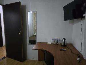 a kitchen with a wooden table and a counter top at Recamara tipo cabaña in Mexico City