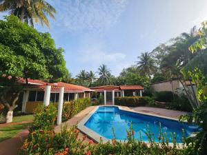 an image of a house with a swimming pool at Enjoy Cabo del Sol Costa del Sol in El Zapote