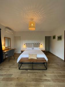 a large bedroom with a large bed with a ceiling at Relais De Mantadia in Andasibe +35 photos